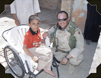 Appel and a boy in a wheelchair