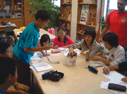Taiwanese students study a local turtle while Reasland evaluates the learning process. 