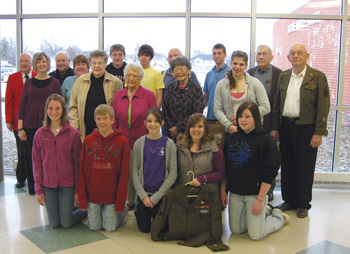 Students from Boone Middle School pose with visiting WWII speakers.