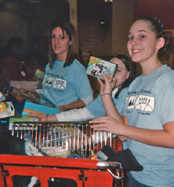 Jones (L) and her students purphase items for Hurricane Katrina victims.