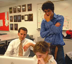 Weintraut (L) works with student editors to get out the news. 