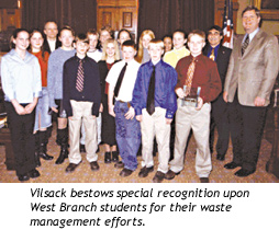 Vilsack bestows special recognition upon West Branch students for their waste management efforts.